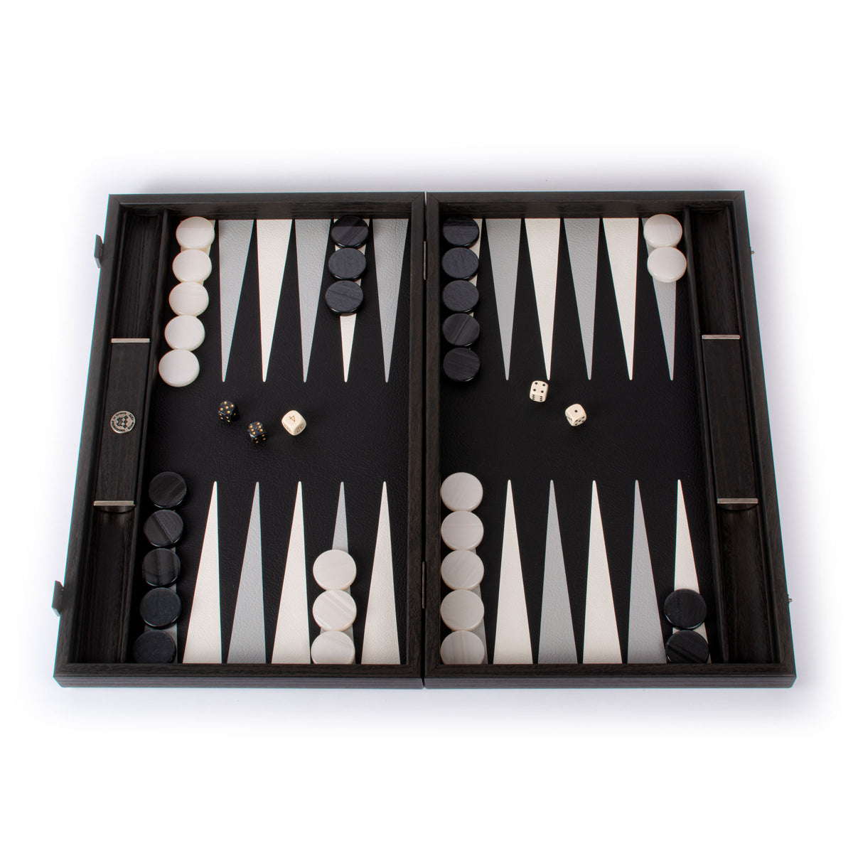 Open black leatherette backgammon set with white and black checkers and dice by MANOPOULOS Chess and Backgammon featuring elegant Greek craftsmanship