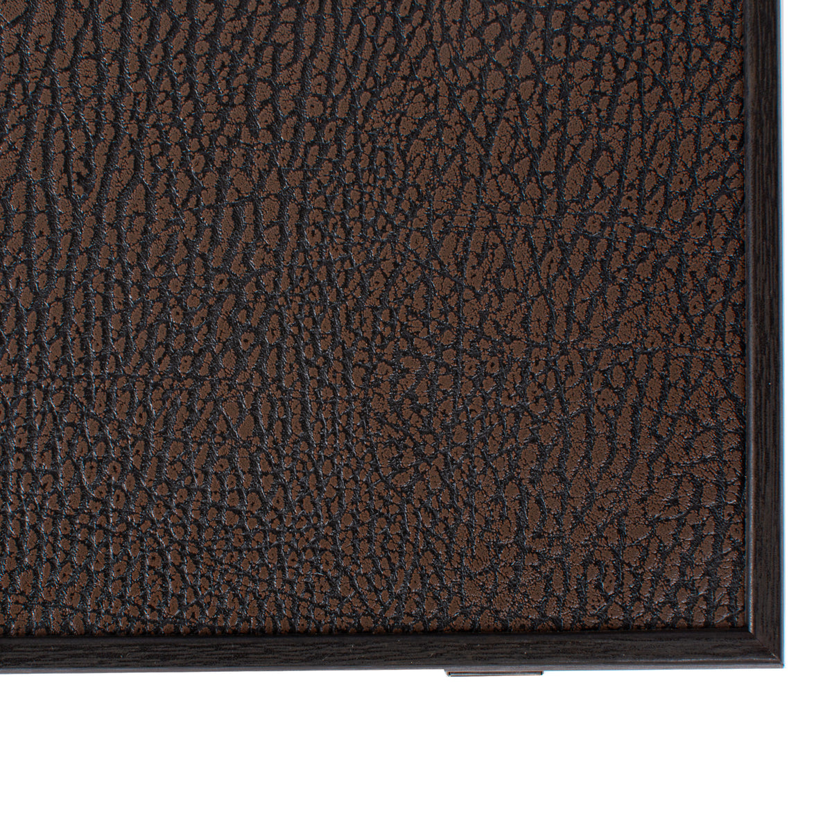 Close up of a premium black leatherette backgammon case with rich textured grain and dark wooden edging, handcrafted by MANOPOULOS Chess and Backgammon