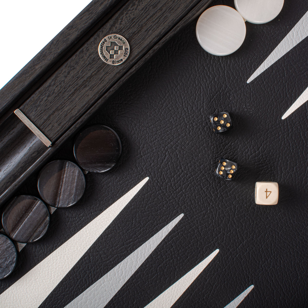 Premium black leatherette backgammon board with cream and dark playing pieces and dice from MANOPOULOS Chess & Backgammon