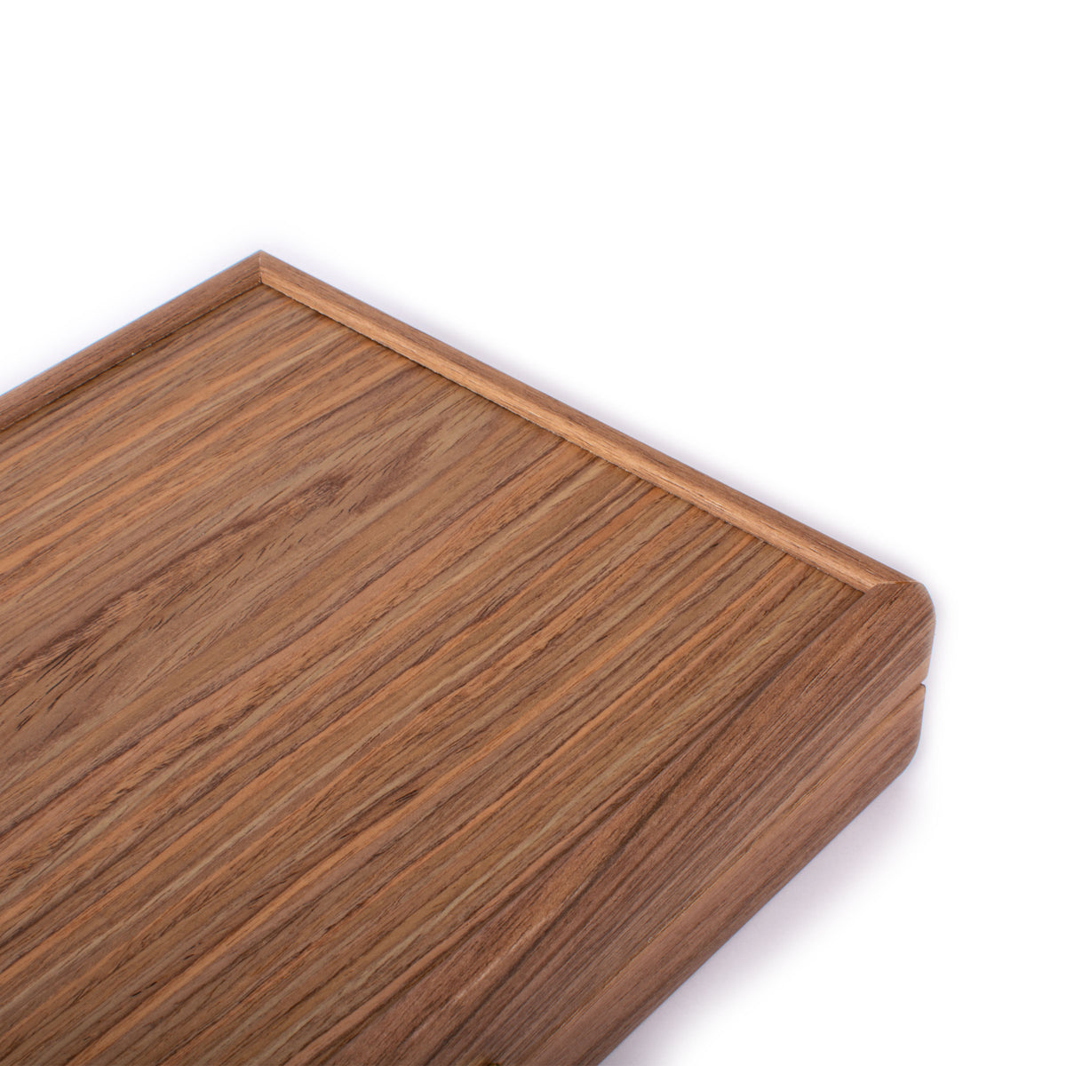 Close view of a richly grained American walnut backgammon board with raised wooden edging by MANOPOULOS Chess and Backgammon, showcasing Greek craftsmanship