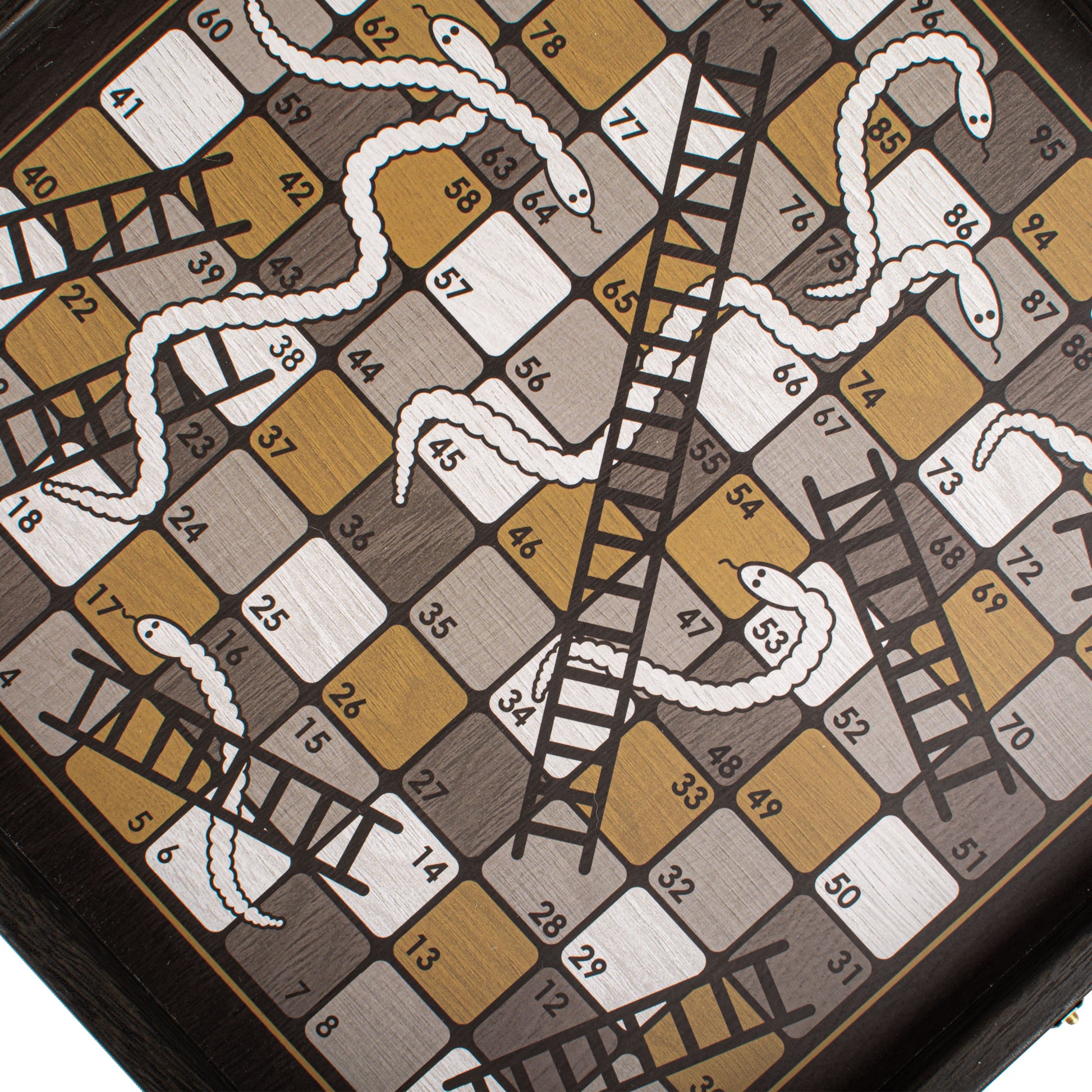 Close-up of the snakes and ladders board from the Modern Style 4-in-1 Combo Game Set: Chess, Backgammon, Ludo & Snakes by MANOPOULOS Chess & Backgammon, showcasing handcrafted Greek craftsmanship with premium materials and artisan-made design reflecting timeless elegance and heritage-inspired style. Handcrafted games, timeless design.