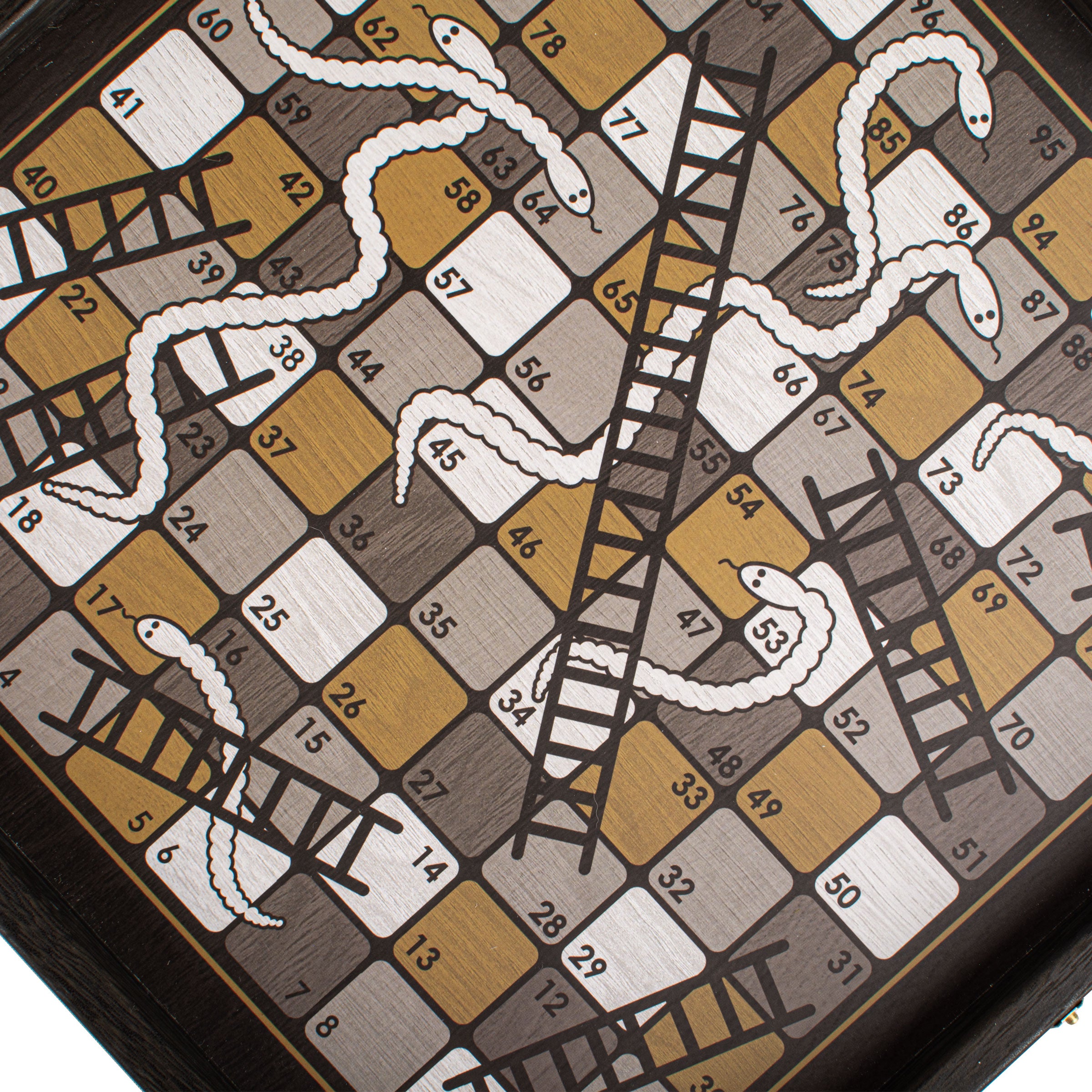 Close-up of the snakes and ladders board from the Modern Style 4-in-1 Combo Game Set: Chess, Backgammon, Ludo & Snakes by MANOPOULOS Chess & Backgammon, showcasing handcrafted Greek craftsmanship with premium materials and artisan-made design reflecting timeless elegance and heritage-inspired style. Handcrafted games, timeless design.