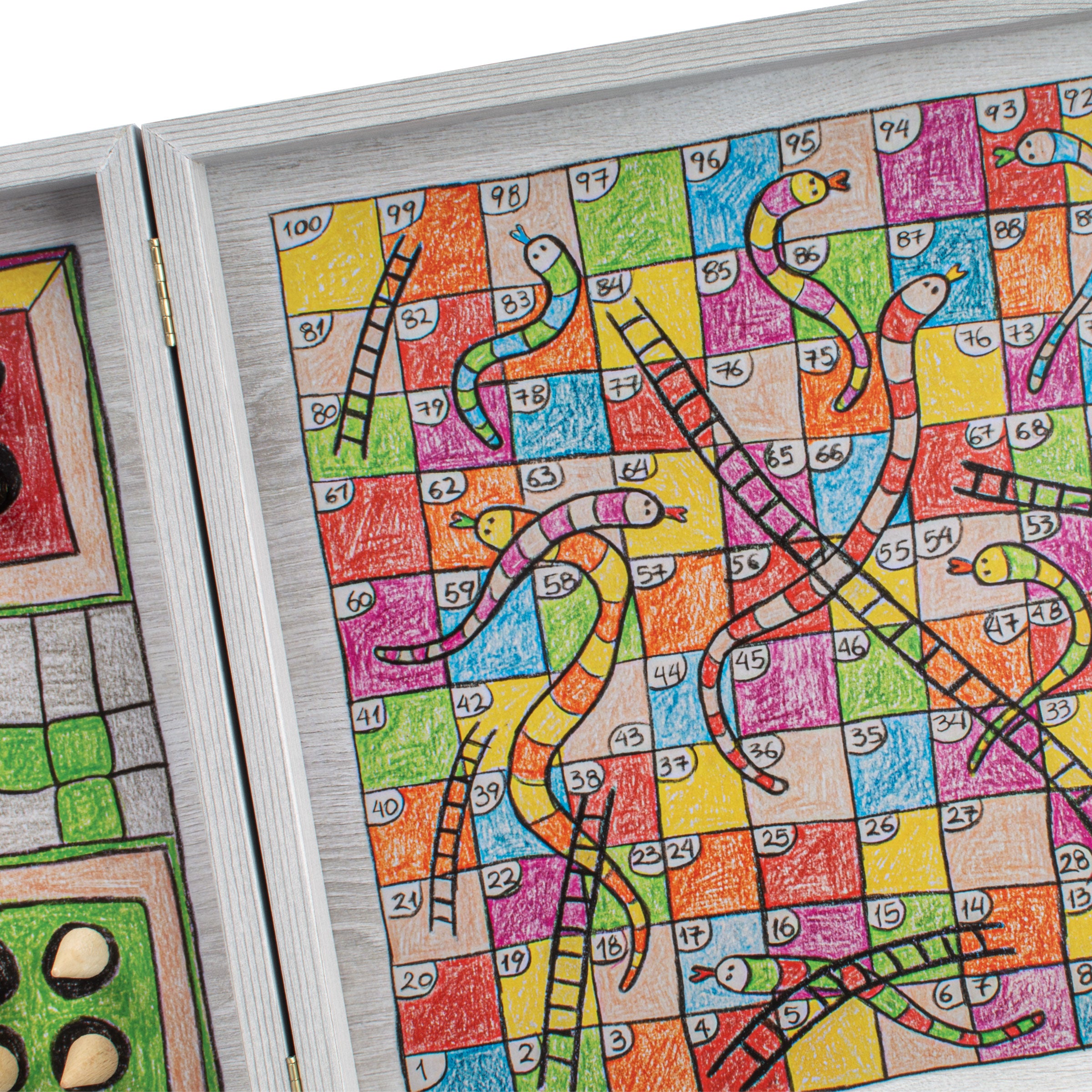 Close-up of the Childrens Freehand Colored Drawing 4-in-1 Combo Game Set: Chess, Backgammon, Ludo & Snakes featuring artisan hand-drawn vibrant snakes and ladders board, showcasing Manopoulos luxury handcrafted games with traditional Greek craftsmanship and timeless design.