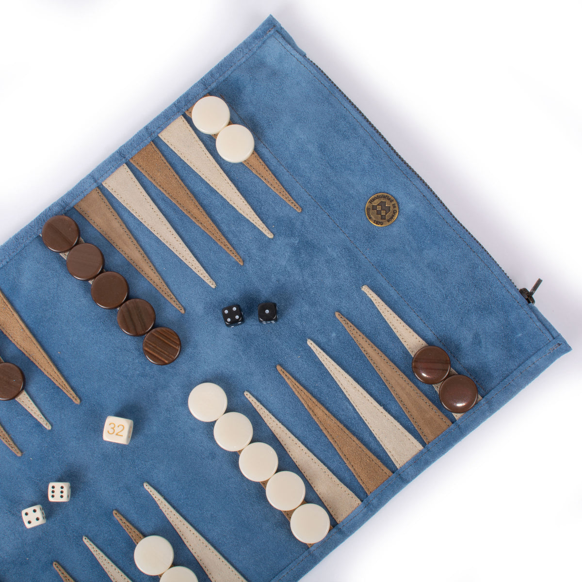 Blue suede roll up backgammon set with leather points, wooden checkers and dice, showcasing Manopoulos Greek craftsmanship and elegant luxury game design