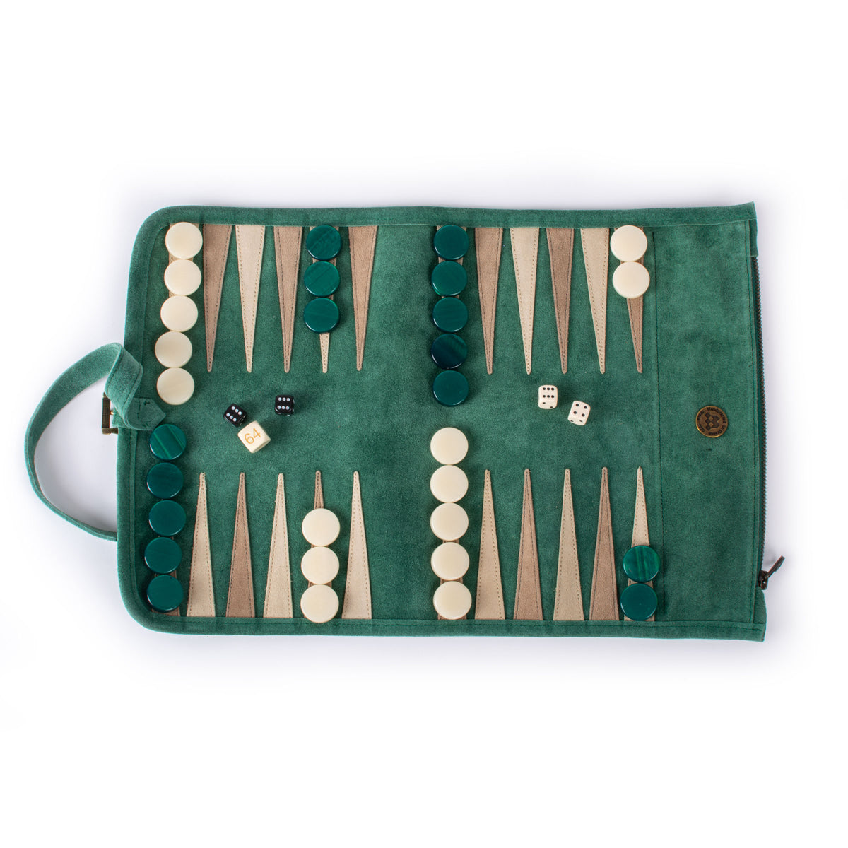 Forest green suede roll up backgammon set with ivory and green pieces and dice displayed on a handcrafted board by MANOPOULOS Chess & Backgammon