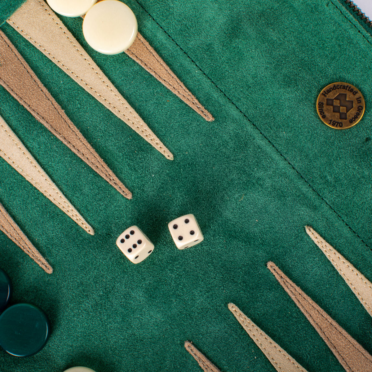 Forest green suede backgammon board with leather points cream dice and checkers from MANOPOULOS Chess & Backgammon showcasing handcrafted Greek luxury