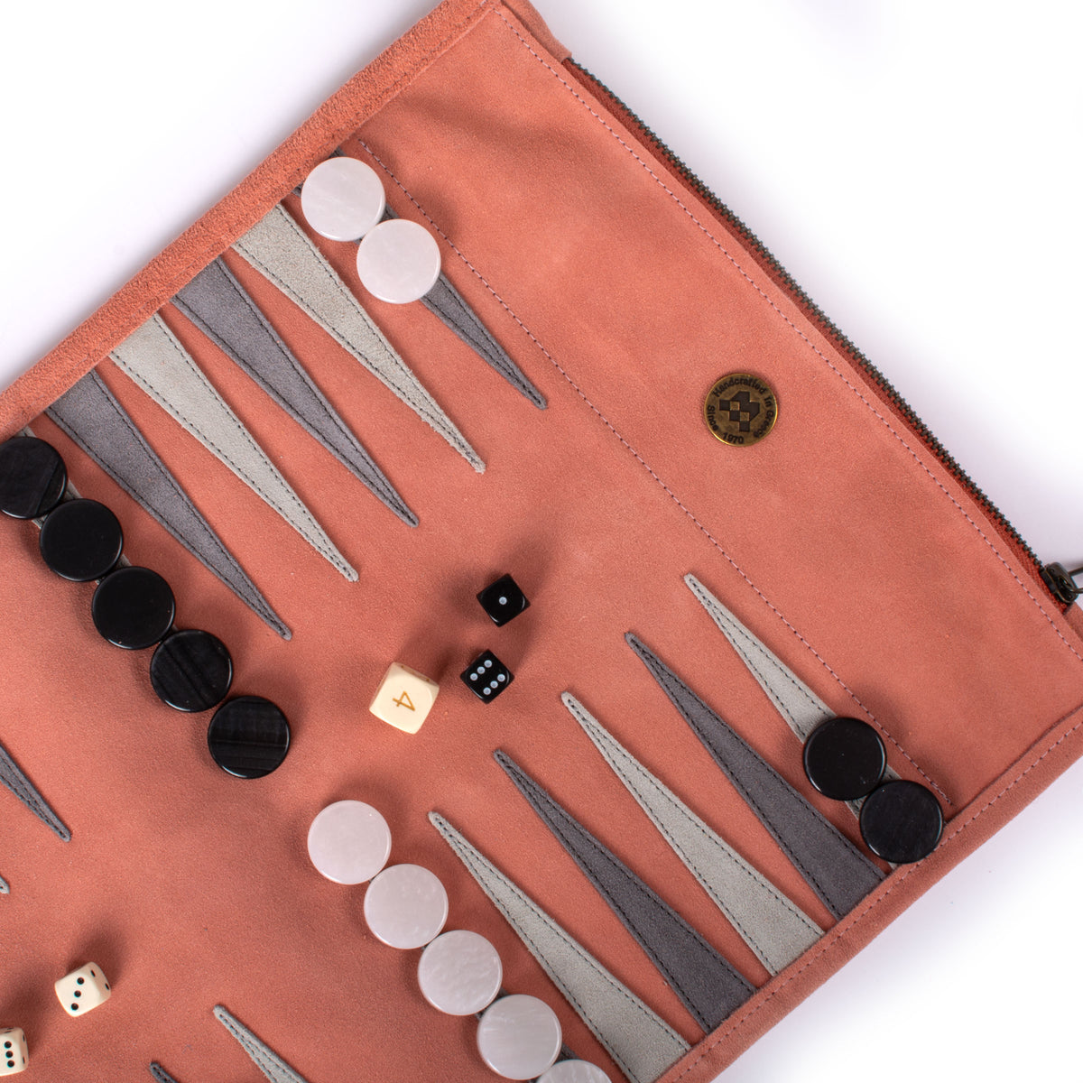 Open salmon suede backgammon board with black and ivory pieces and dice showcasing luxury craftsmanship by MANOPOULOS Chess and Backgammon