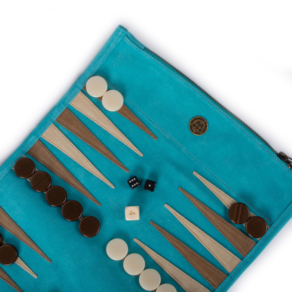 Turquoise suede roll up backgammon set with brown and ivory checkers and dice arranged on the board by MANOPOULOS Chess and Backgammon