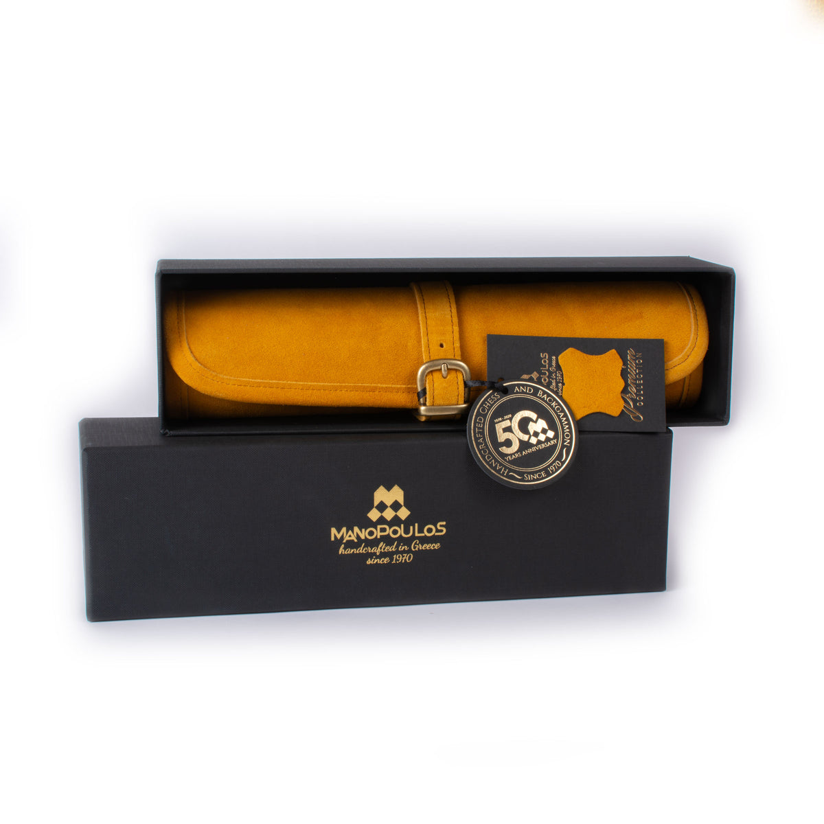 Warm yellow suede roll up backgammon set in a black presentation box by MANOPOULOS Chess and Backgammon showcasing handcrafted Greek luxury design