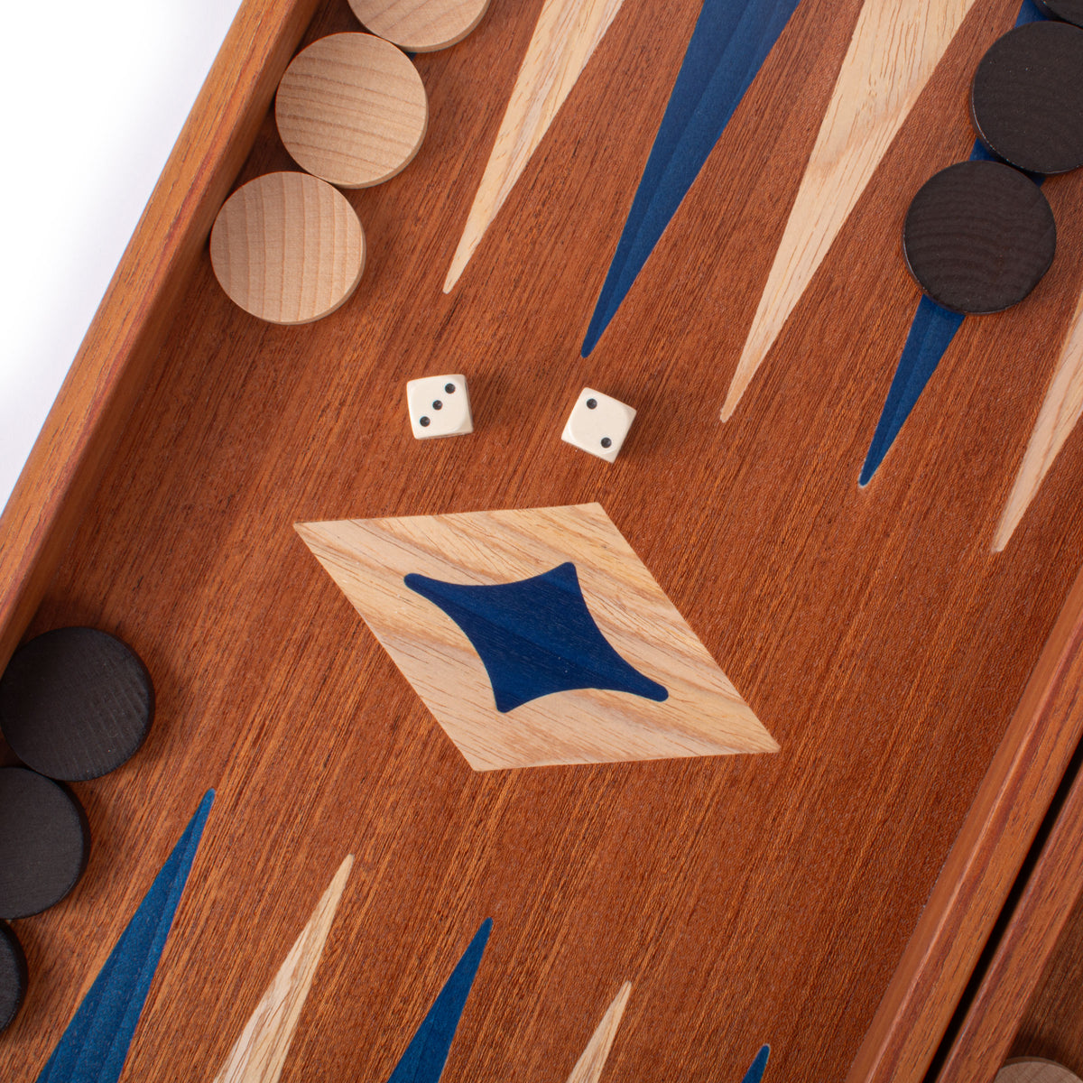Close view of a handcrafted mahogany backgammon board with blue marquetry inlays wooden checkers and dice by MANOPOULOS Chess and Backgammon