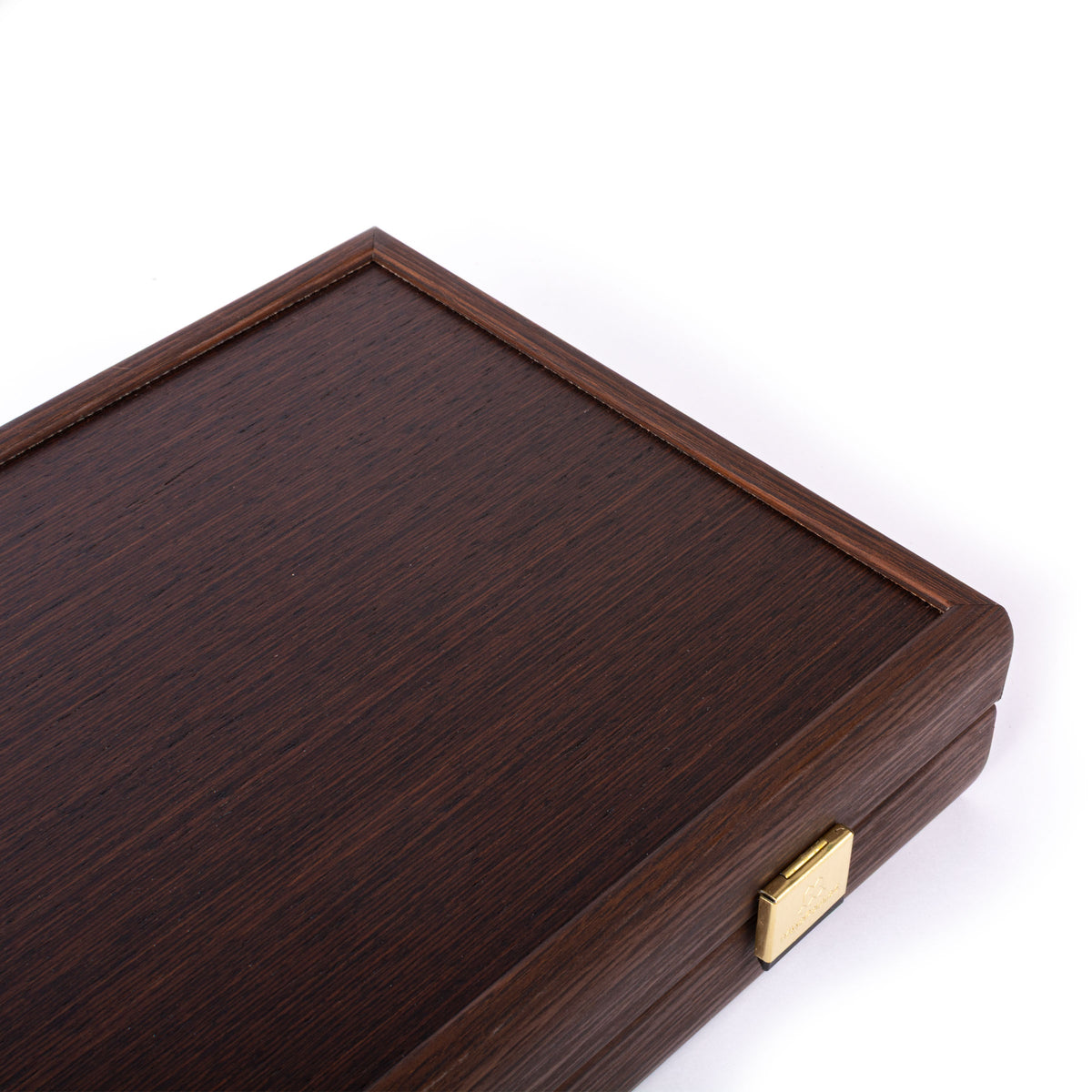 Closed dark wenge wood backgammon case with a refined border and brass clasp by Manopoulos showcasing Greek craftsmanship and timeless design