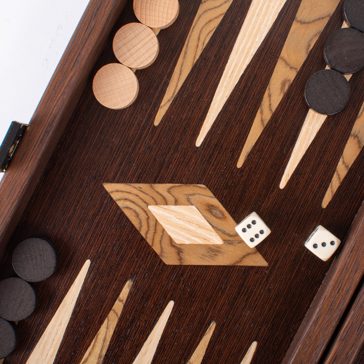 Close view of a handcrafted wenge and walnut burl backgammon board with marquetry detailing wooden checkers and dice by Manopoulos Chess and Backgammon