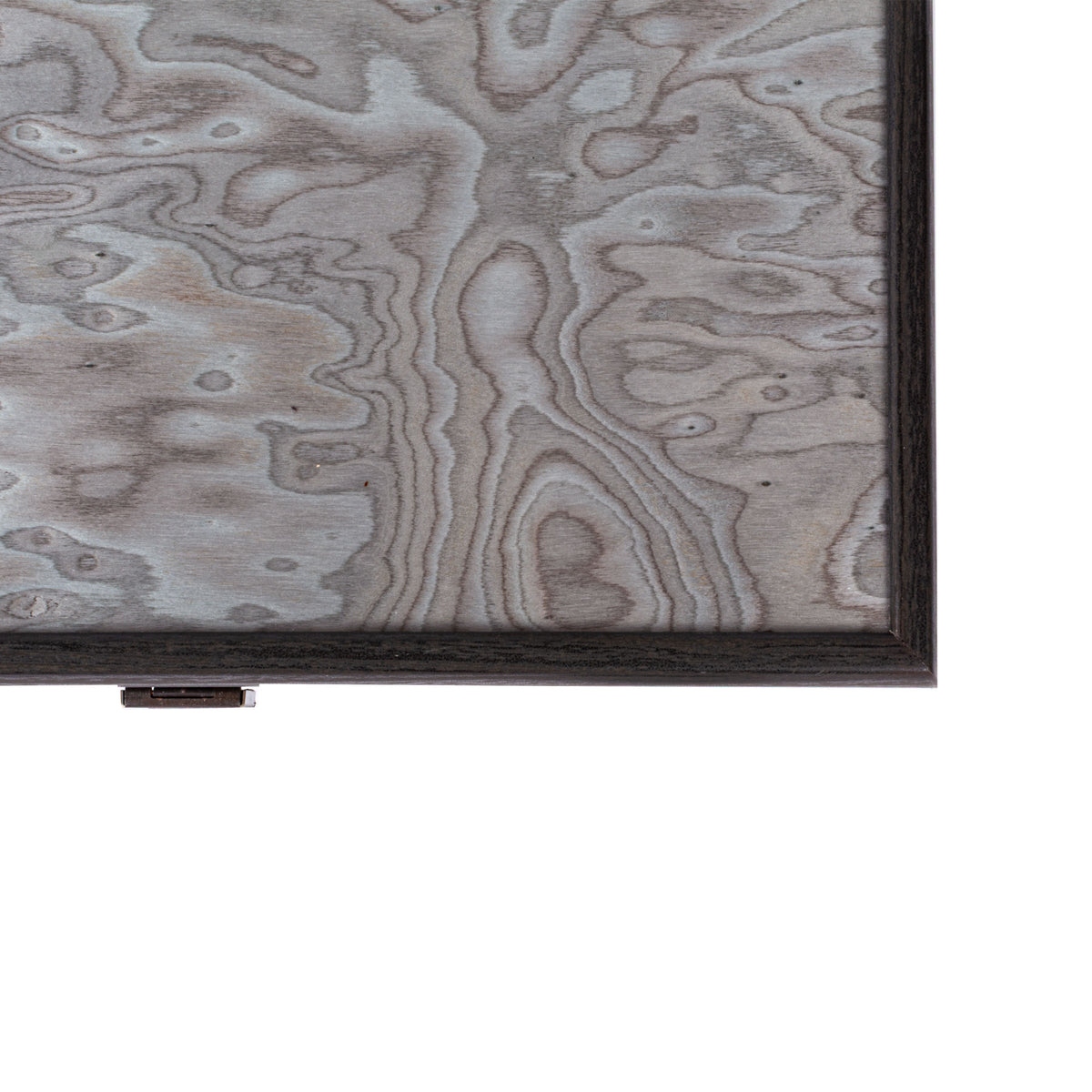 Close view of a pearly grey vavona burl backgammon board with dark wood edging and clasp showcasing Manopoulos handcrafted luxury design